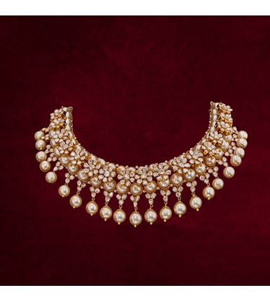 Gold necklace with flower shaped Polki diamonds with pearl drops
