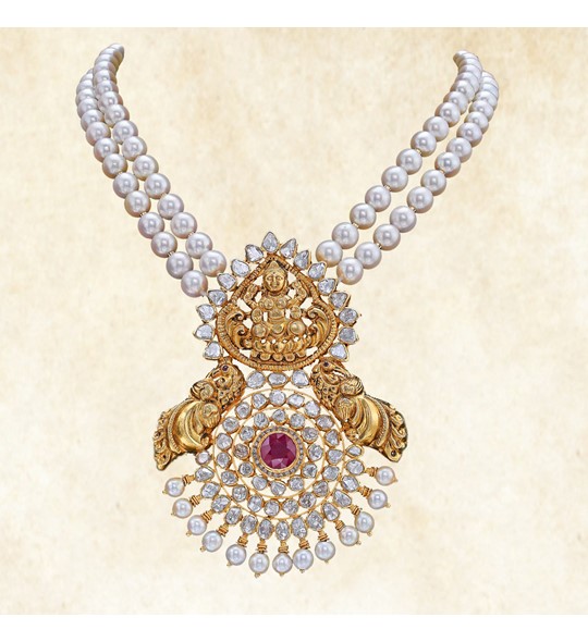 Two layer pearl necklace with gold Lakshmi pendant