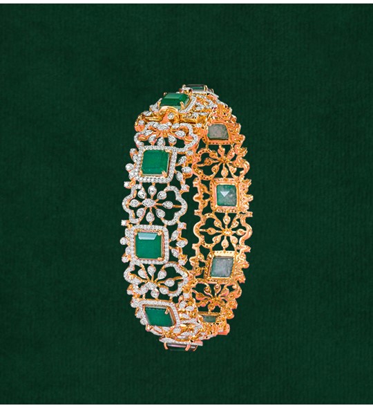 Diamond, Emerald Bangle crafted using yellow gold