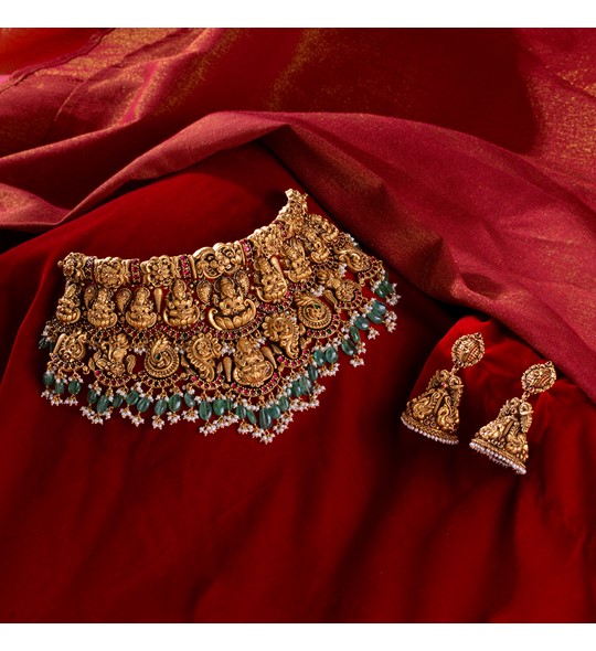 Indian bridal gold necklace sets in Nakshi Work with Guttapusalu