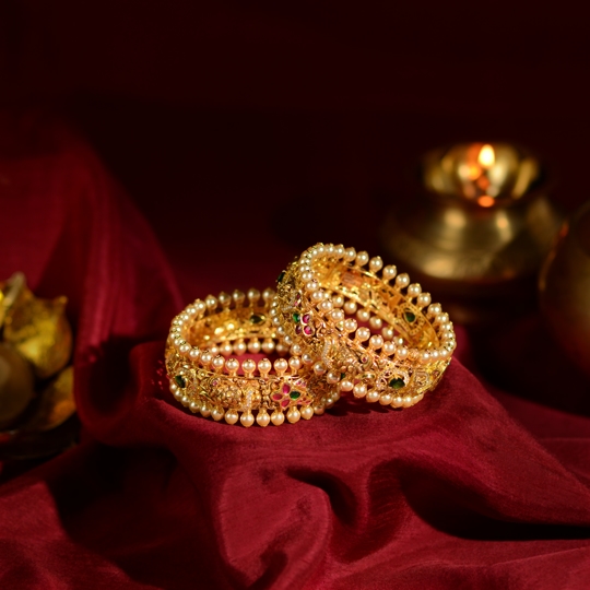 Traditional Gold Bangles with Temple Carvings