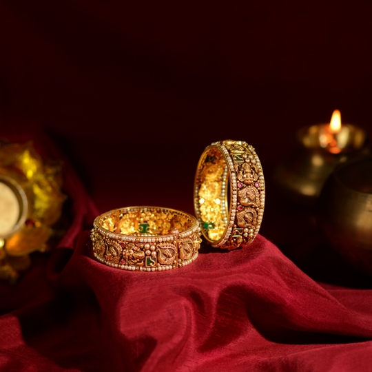 Gold Bangles with Laxmi and Shankha Motif